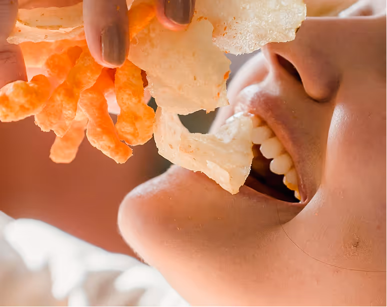 Side view close-up of a person eating baked potato tenis.